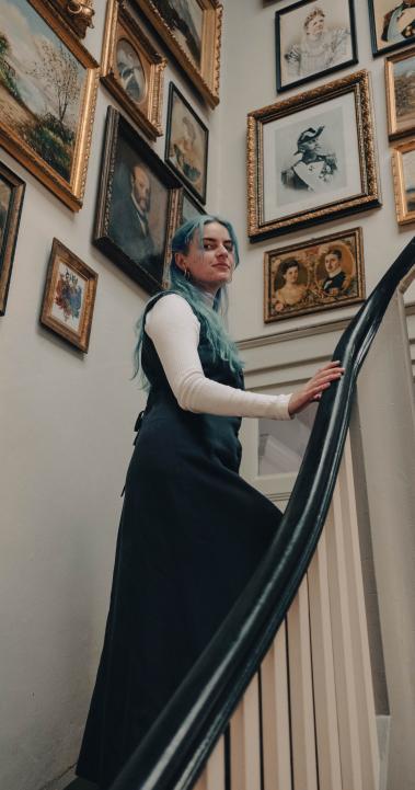 A student walks up the stars in the Gründerzeit Museum in Berlin, Germany.