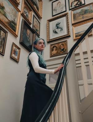 A student walks up the stars in the Gründerzeit Museum in Berlin, Germany.