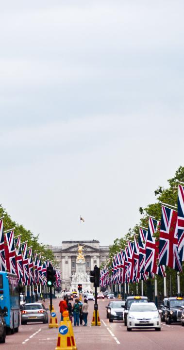a British flag-lined street leading up to the Victoria Memorial