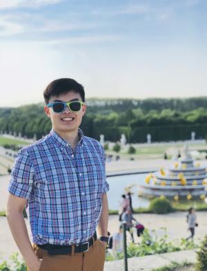 a student intern posing for a photo in Paris