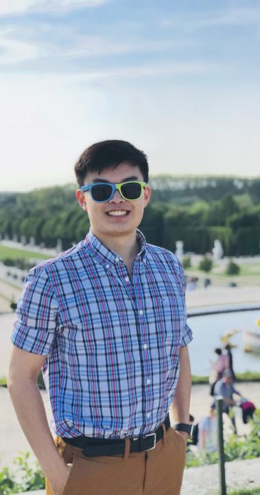 a student intern posing for a photo in Paris